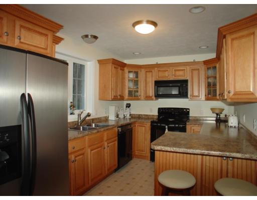 385 Williamsville Road Phillipston, MA 01331 - Photo 2 of 18 a kitchen with kitchen island granite countertop a sink dishwasher stove and refrigerator with wooden floor