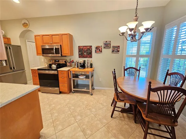 a dining room with furniture and window
