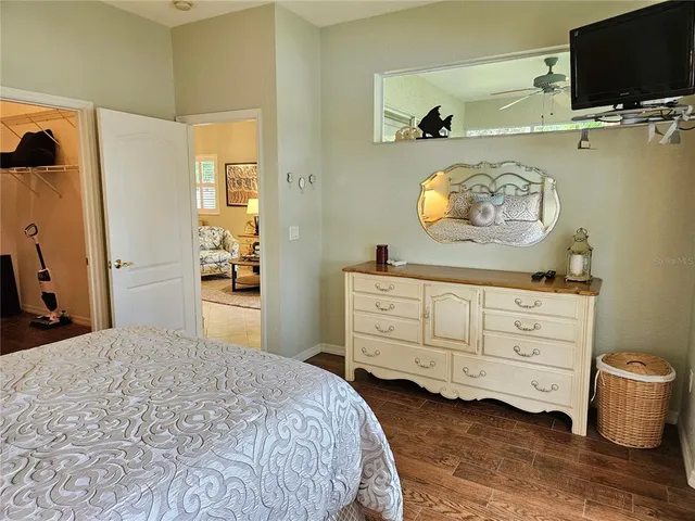 a bedroom with a bed and cabinets