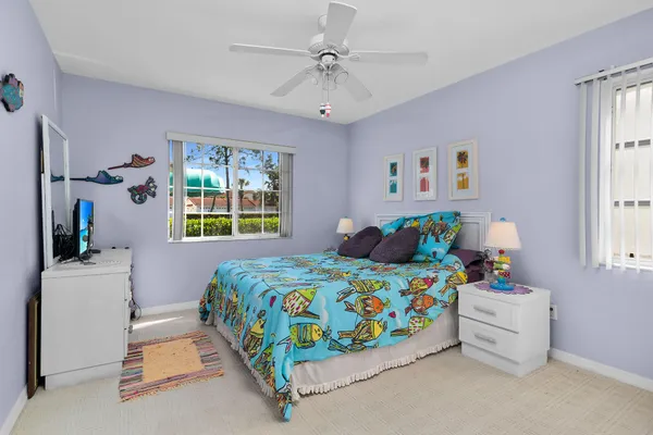 a bedroom that has a bed and a table in it