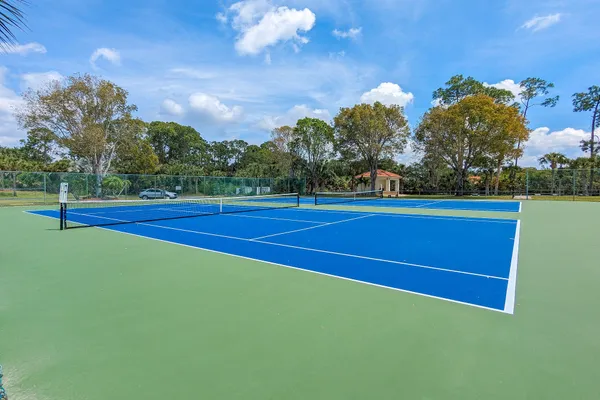 a view of an outdoor space and tennis court