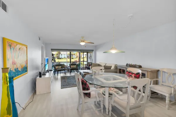 a view of a dining room with furniture and a livingroom