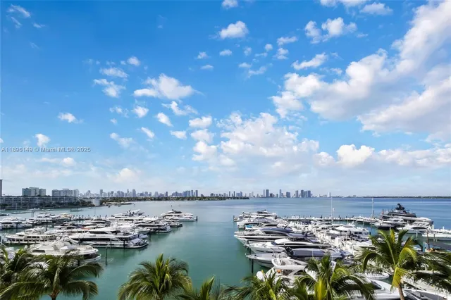 a living room with furniture stove and a large window