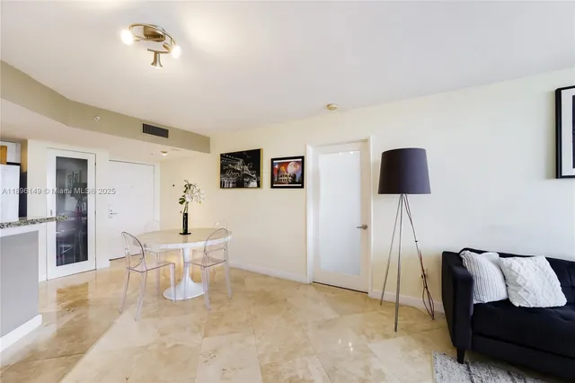 a kitchen with stainless steel appliances granite countertop a sink stove oven and refrigerator
