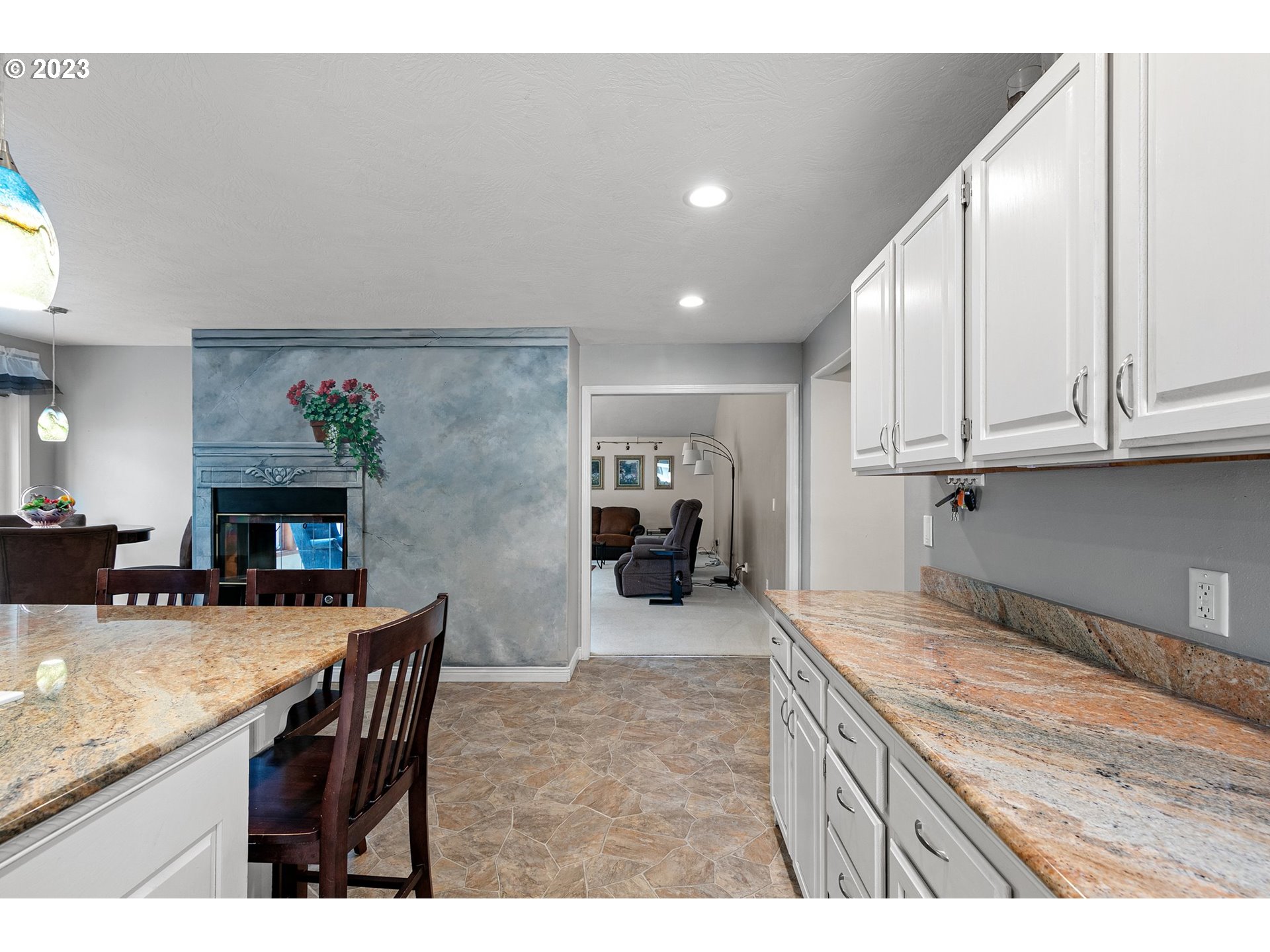 184 73rd Place Springfield, OR 97478 - Photo 11 of 48 a kitchen with stainless steel appliances granite countertop a stove top oven a sink dishwasher and cabinets with wooden floor