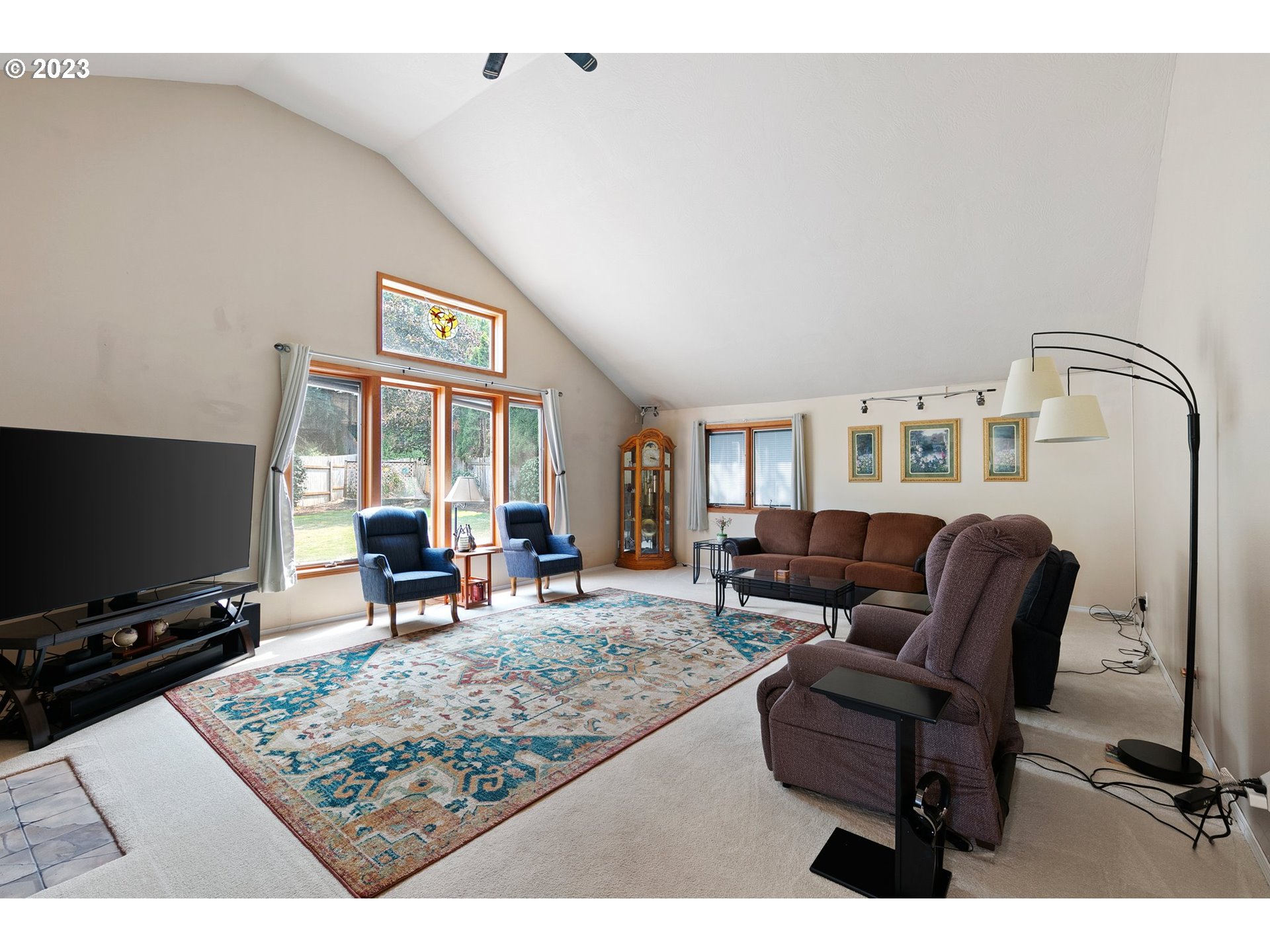 184 73rd Place Springfield, OR 97478 - Photo 13 of 48 a living room with furniture and a flat screen tv