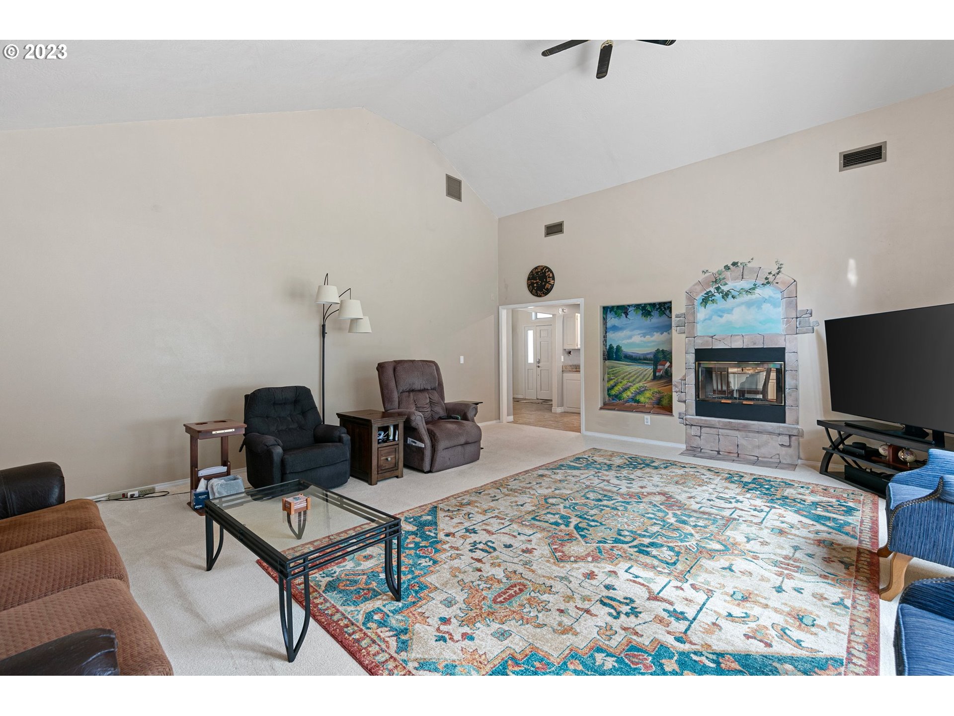 184 73rd Place Springfield, OR 97478 - Photo 16 of 48 a living room with furniture and a flat screen tv