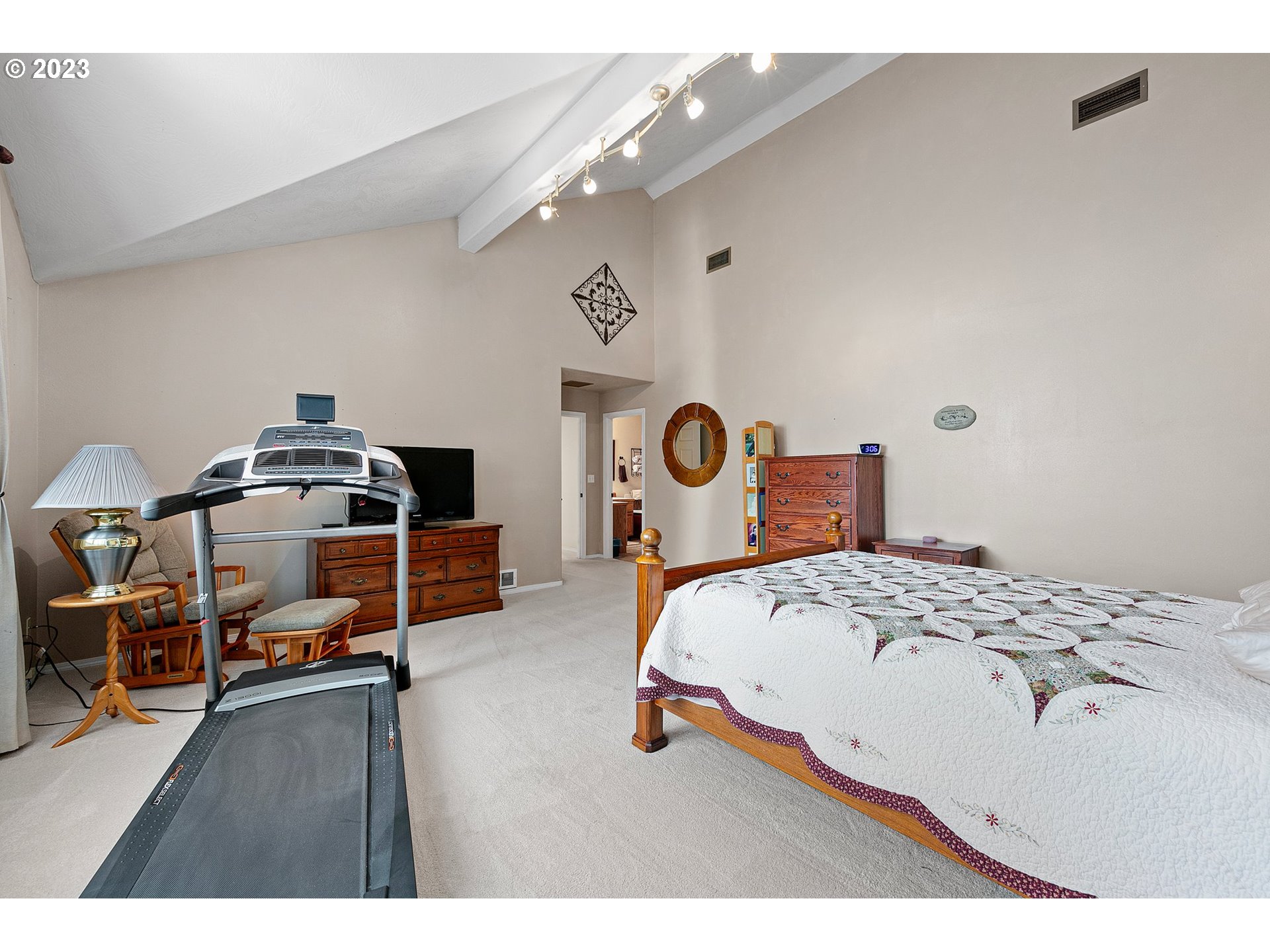 184 73rd Place Springfield, OR 97478 - Photo 24 of 48 a bedroom with a bed and a chandelier
