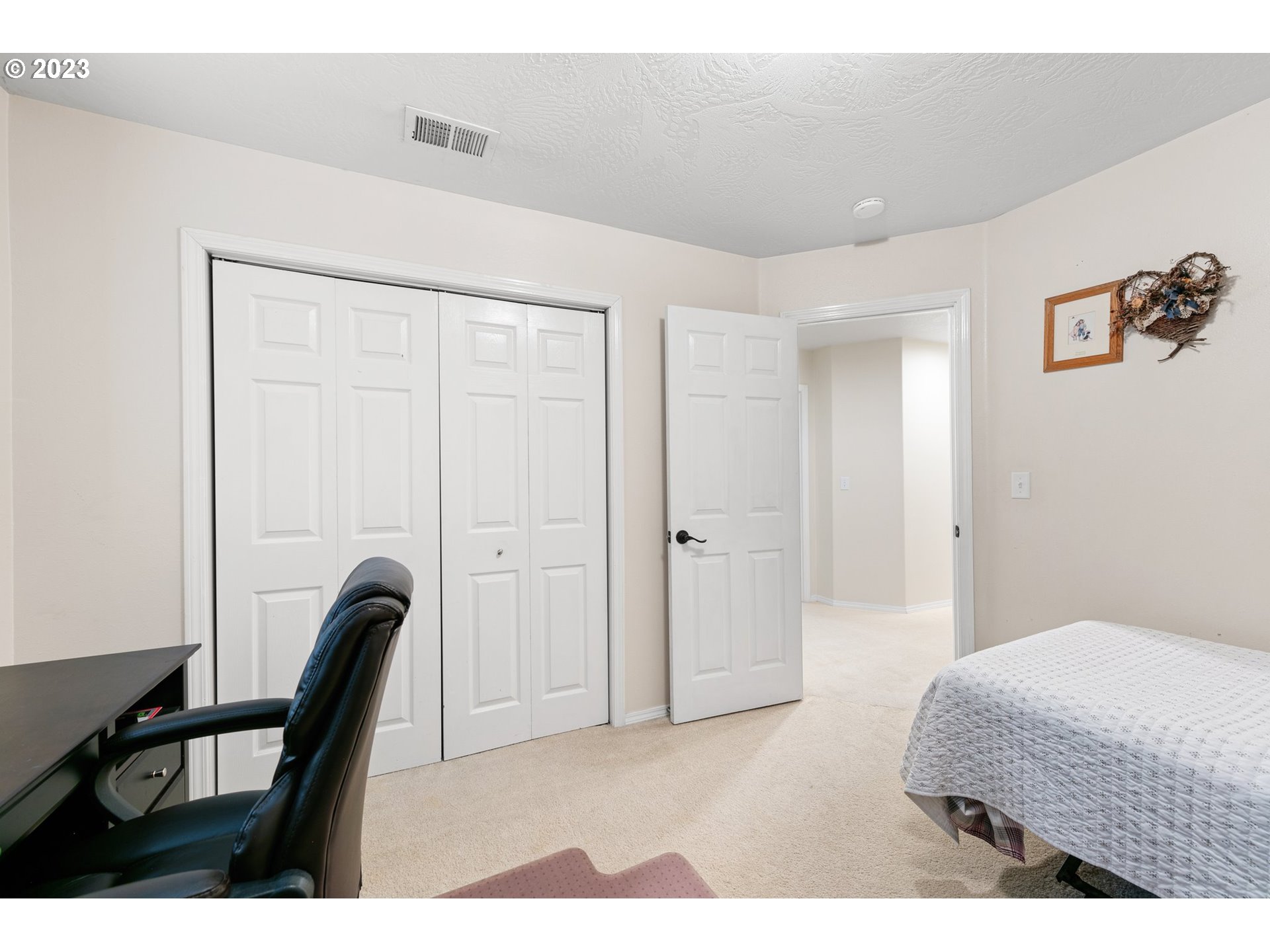 184 73rd Place Springfield, OR 97478 - Photo 30 of 48 a bedroom with a bed a desk and chair