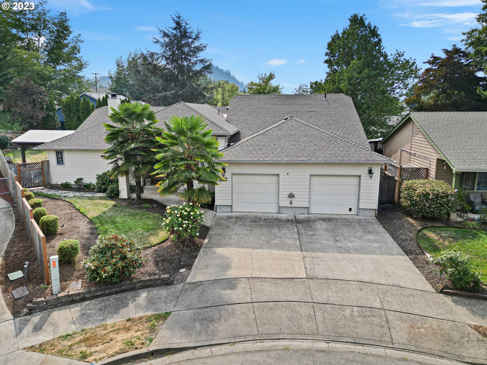 184 73rd Place Springfield, OR 97478 - Photo 45 of 48 a view of a house with a yard and potted plants