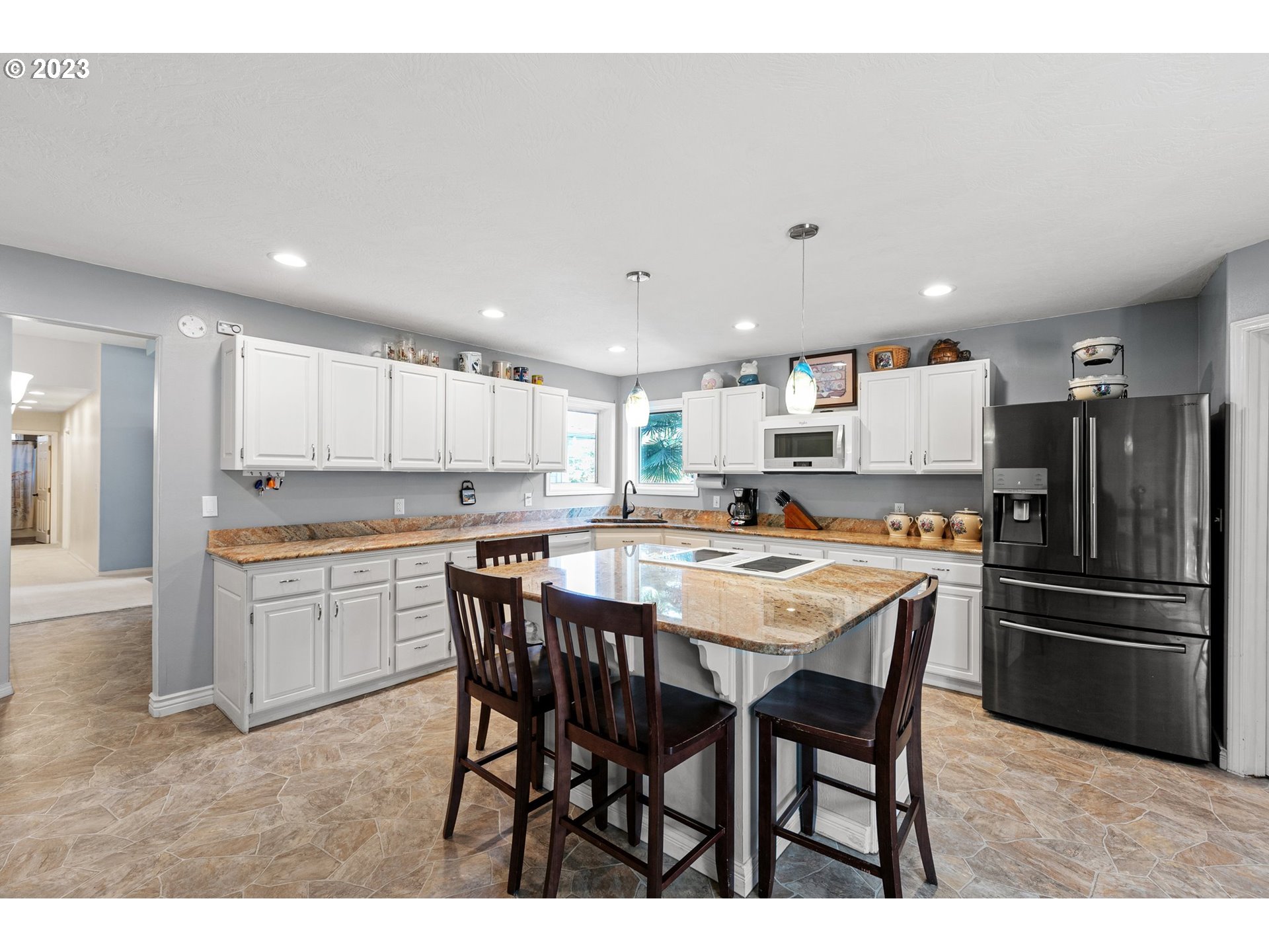 184 73rd Place Springfield, OR 97478 - Photo 8 of 48 a kitchen with a table and chairs in it