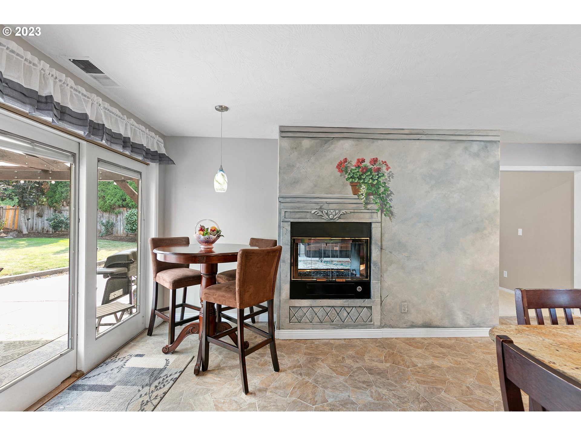 184 73rd Place Springfield, OR 97478 - Photo 10 of 48 a dining room with furniture and a fireplace