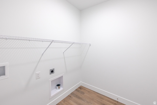 675 West 4500th South, Unit P301 Mapleton, UT 84664 - Photo 4 of 16 Dedicated utility space featuring a white wire shelf, wood-finish flooring, and white wall finishes