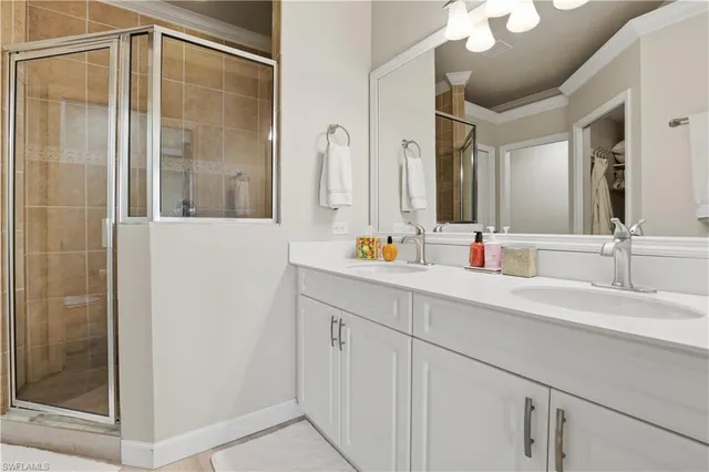 a bathroom with a shower sink and mirror