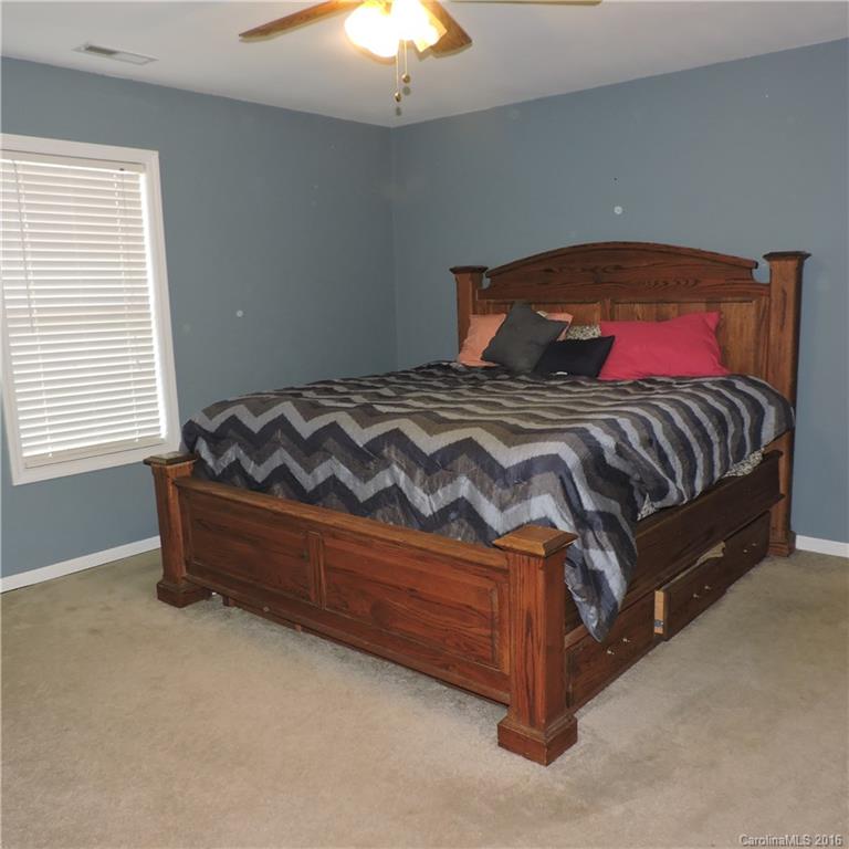 4594 Wylies Mill Road, Unit 1 Edgemoor, SC 29712 - Photo 3 of 11 a bedroom with a bed and window