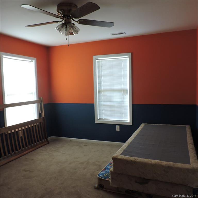 4594 Wylies Mill Road, Unit 1 Edgemoor, SC 29712 - Photo 5 of 11 a room with a bed and a window