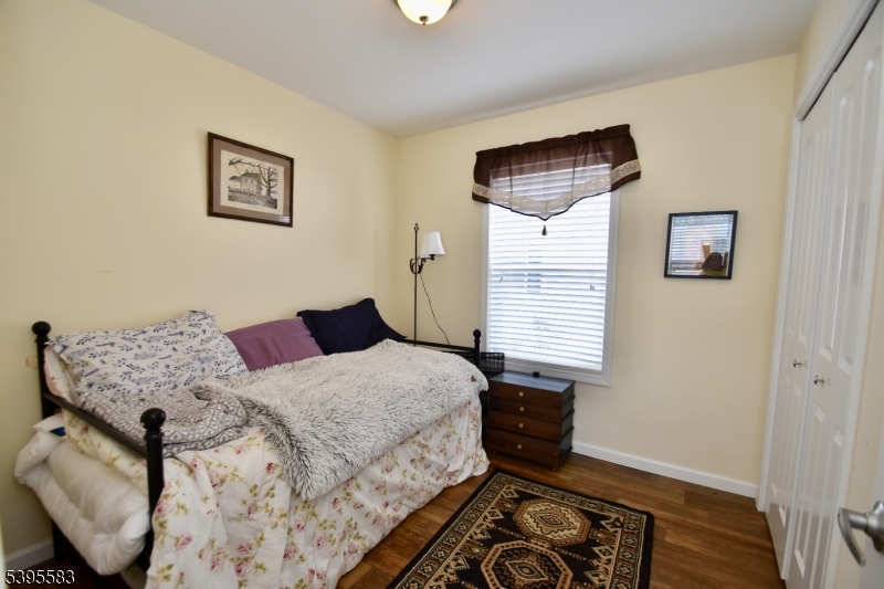 18 Easy Drive Oak Ridge, NJ 07438 - Photo 12 of 15 a bedroom with a bed and wooden floor