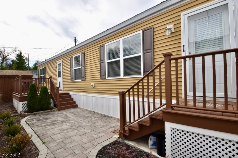 18 Easy Drive Oak Ridge, NJ 07438 - Photo 15 of 15 a front view of a house with a barbeque