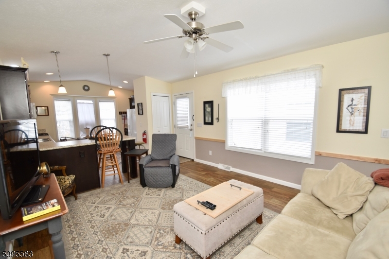 18 Easy Drive Oak Ridge, NJ 07438 - Photo 4 of 15 a living room with furniture gym equipment and a window