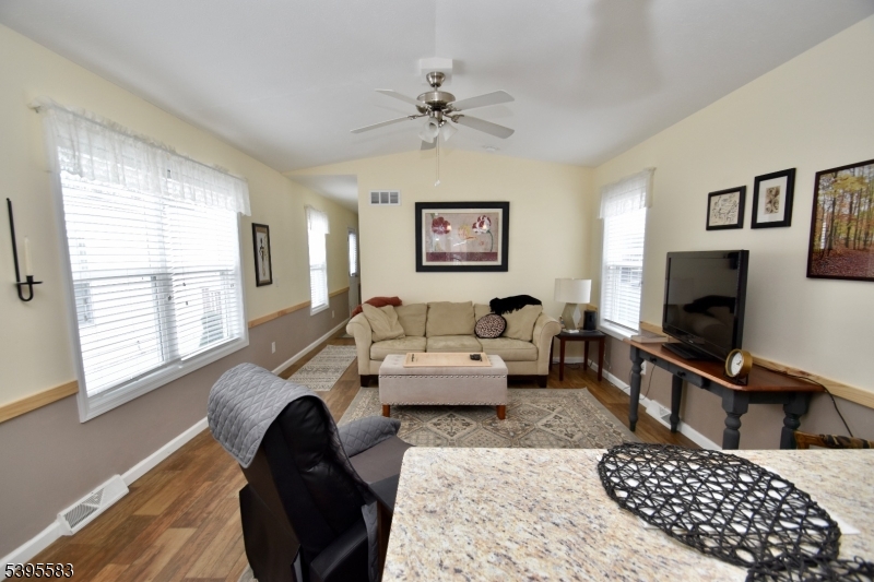 18 Easy Drive Oak Ridge, NJ 07438 - Photo 5 of 15 a living room with furniture and a flat screen tv