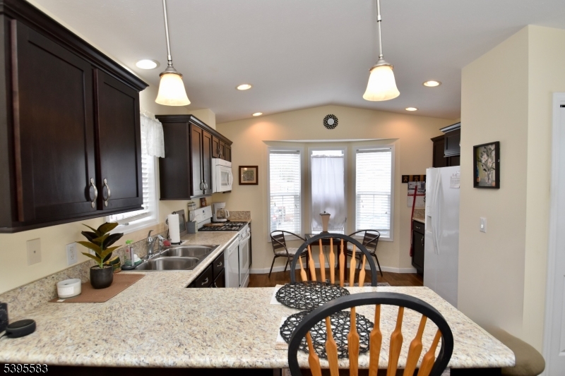 18 Easy Drive Oak Ridge, NJ 07438 - Photo 7 of 15 a view of living room and kitchen with furniture