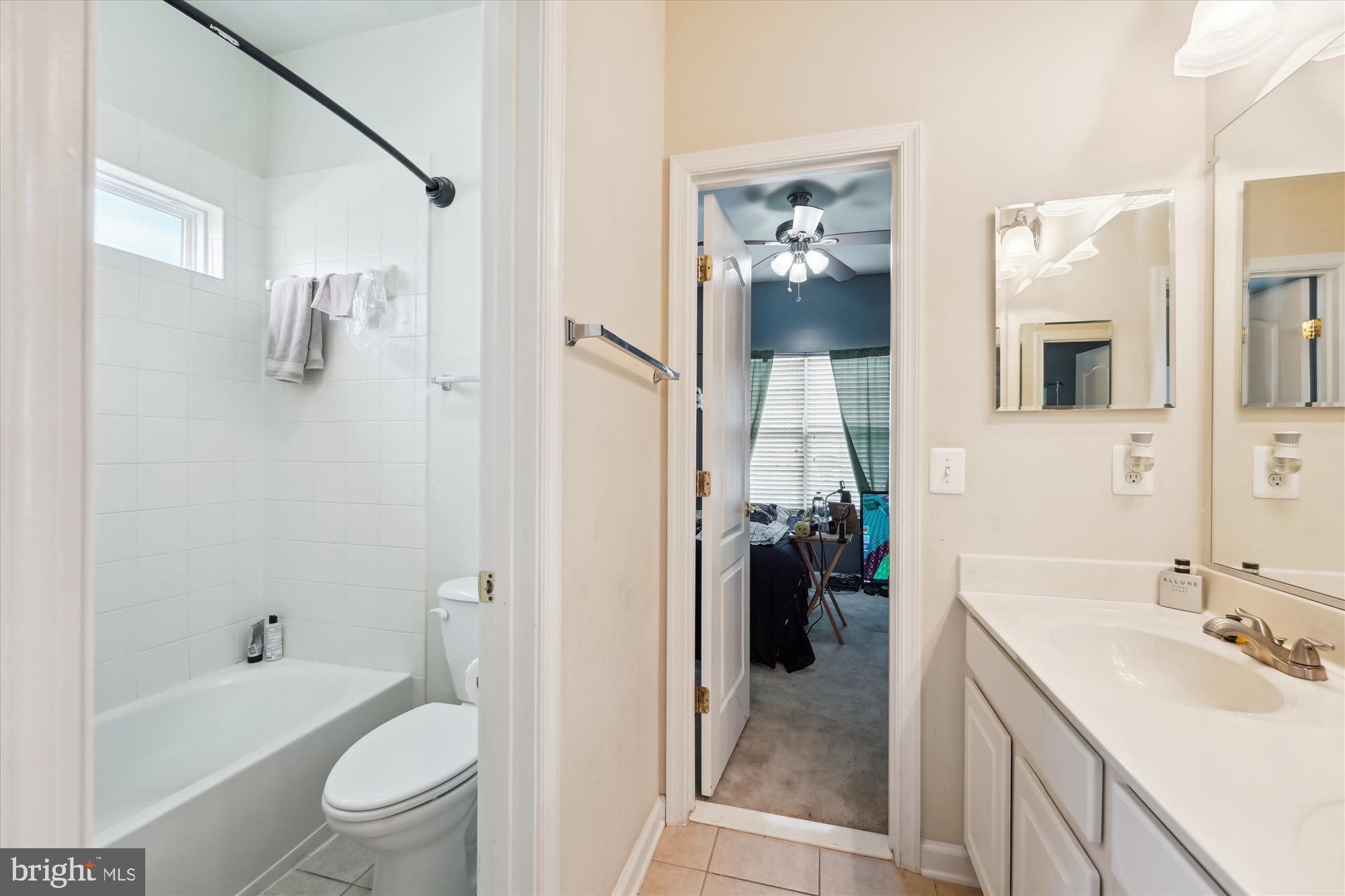 7306 Sudley Avenue Brandywine, MD 20613 - Photo 15 of 46 a bathroom with a tub sink toilet and mirror
