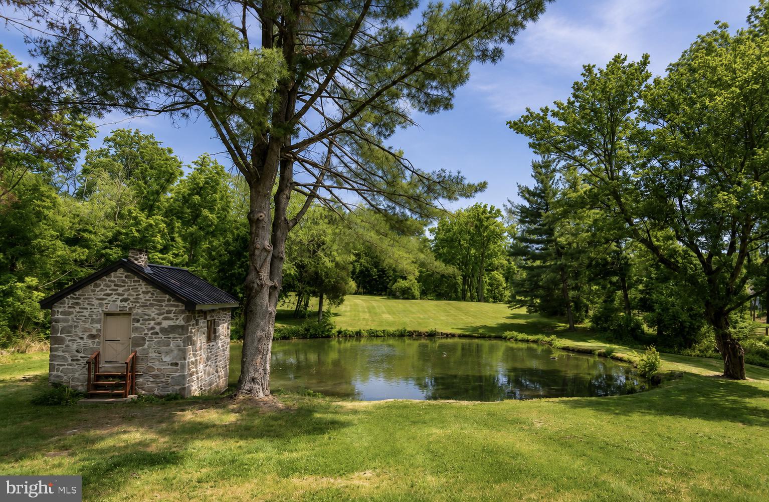 108 Sheeder Road Phoenixville, PA 19460 - Photo 3 of 42 a view of a lake with a yard