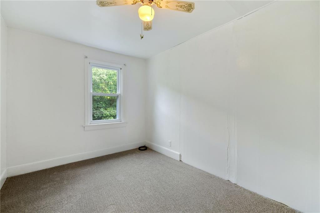 223 Thompson Run Road Pittsburgh, PA 15237 - Photo 11 of 23 an empty room with a window