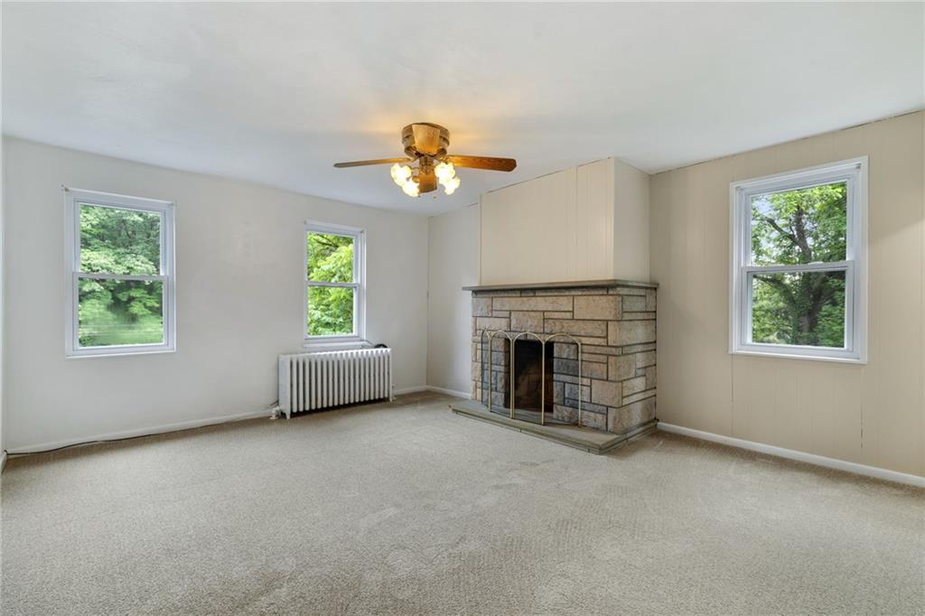 223 Thompson Run Road Pittsburgh, PA 15237 - Photo 9 of 23 an empty room with windows and fireplace