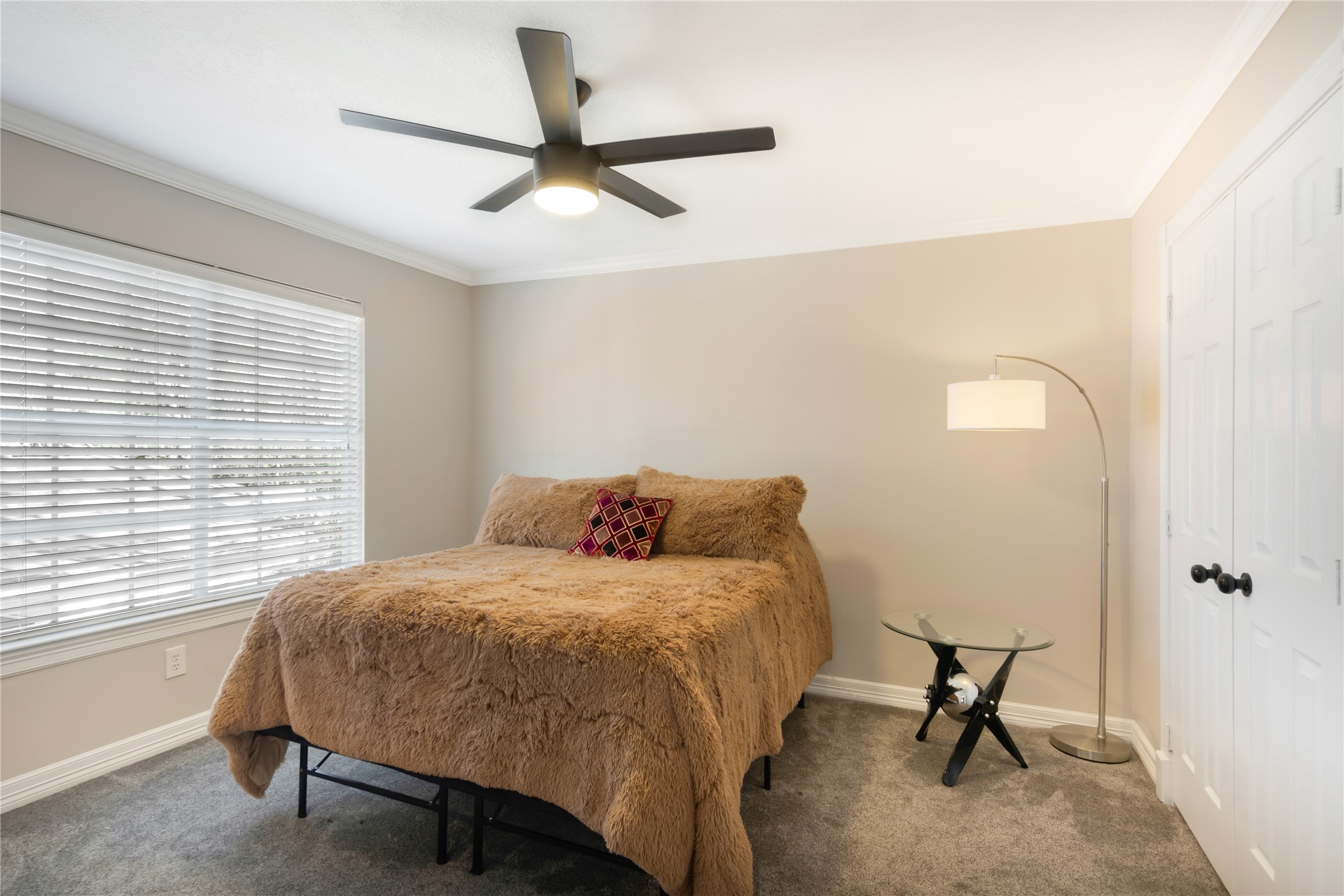 6211 Kingscrest Lane Spring, TX 77389 - Photo 31 of 39 a bedroom with a bed and a window