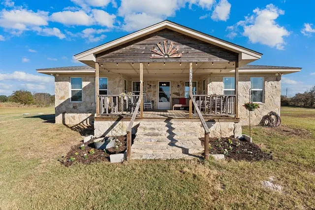 a view of a house with patio outdoor seating area