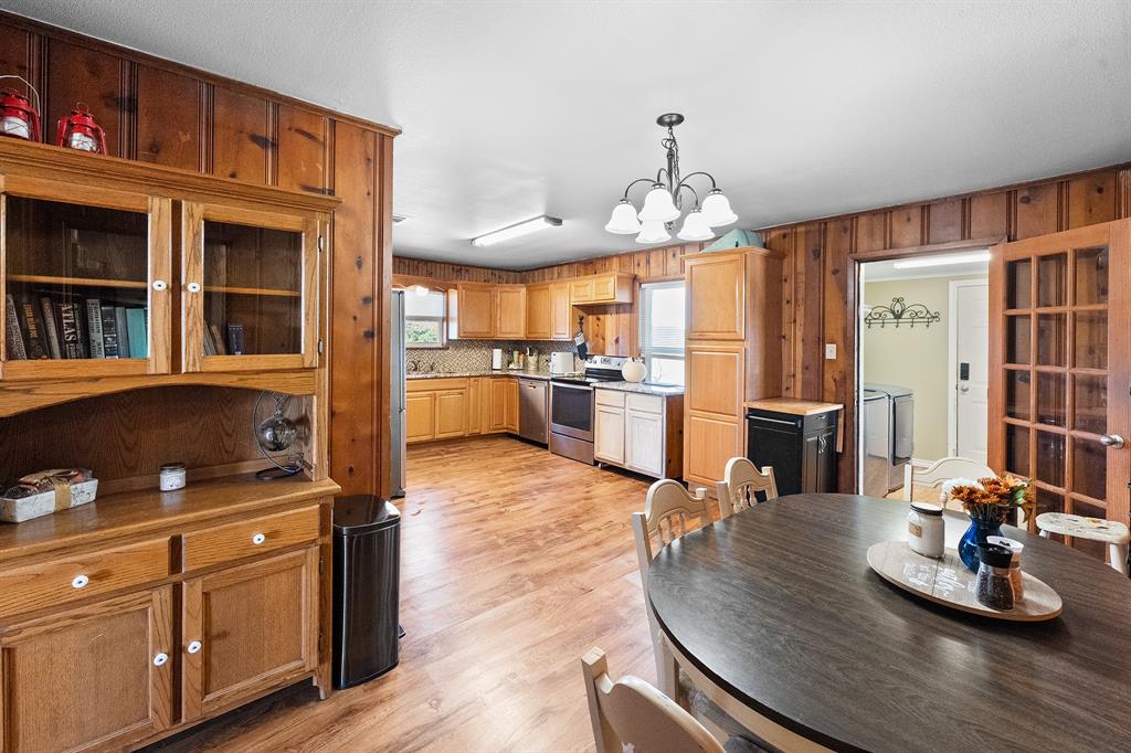 17215 Tarlton Road Mabank, TX 75147 - Photo 25 of 34 a kitchen with stainless steel appliances kitchen island granite countertop a stove and cabinets