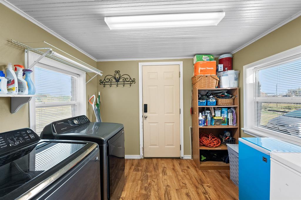 17215 Tarlton Road Mabank, TX 75147 - Photo 34 of 34 a kitchen that has a sink cabinets and a stove top oven