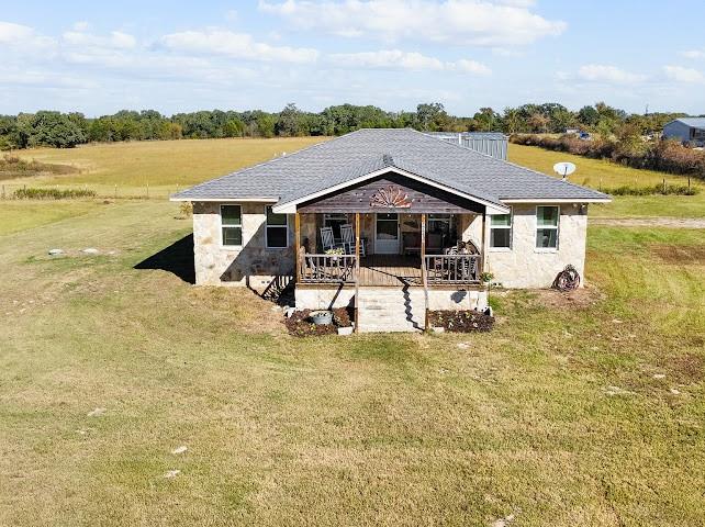 17215 Tarlton Road Mabank, TX 75147 - Photo 5 of 34 a view of a lake with a house in the background