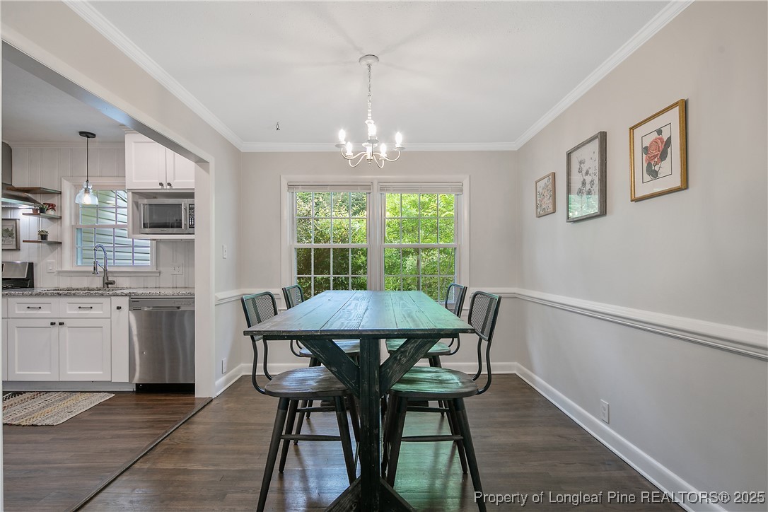 2615 Huntington Road Fayetteville, NC 28303 - Photo 12 of 47 a view of a dining room with furniture window and outside view