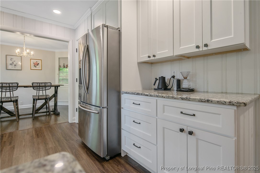 2615 Huntington Road Fayetteville, NC 28303 - Photo 20 of 47 a kitchen with stainless steel appliances granite countertop a refrigerator sink and cabinets