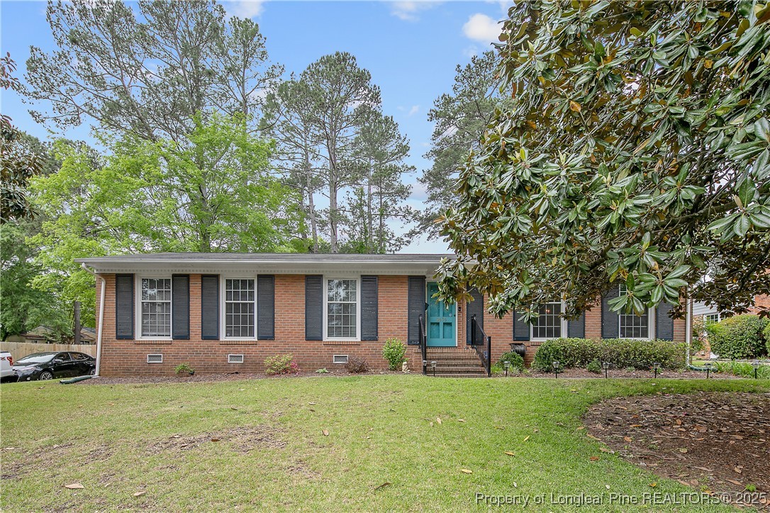 2615 Huntington Road Fayetteville, NC 28303 - Photo 2 of 47 front view of a house with a yard