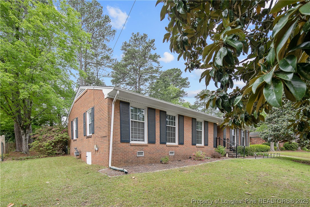 2615 Huntington Road Fayetteville, NC 28303 - Photo 4 of 47 front view of a house with a yard