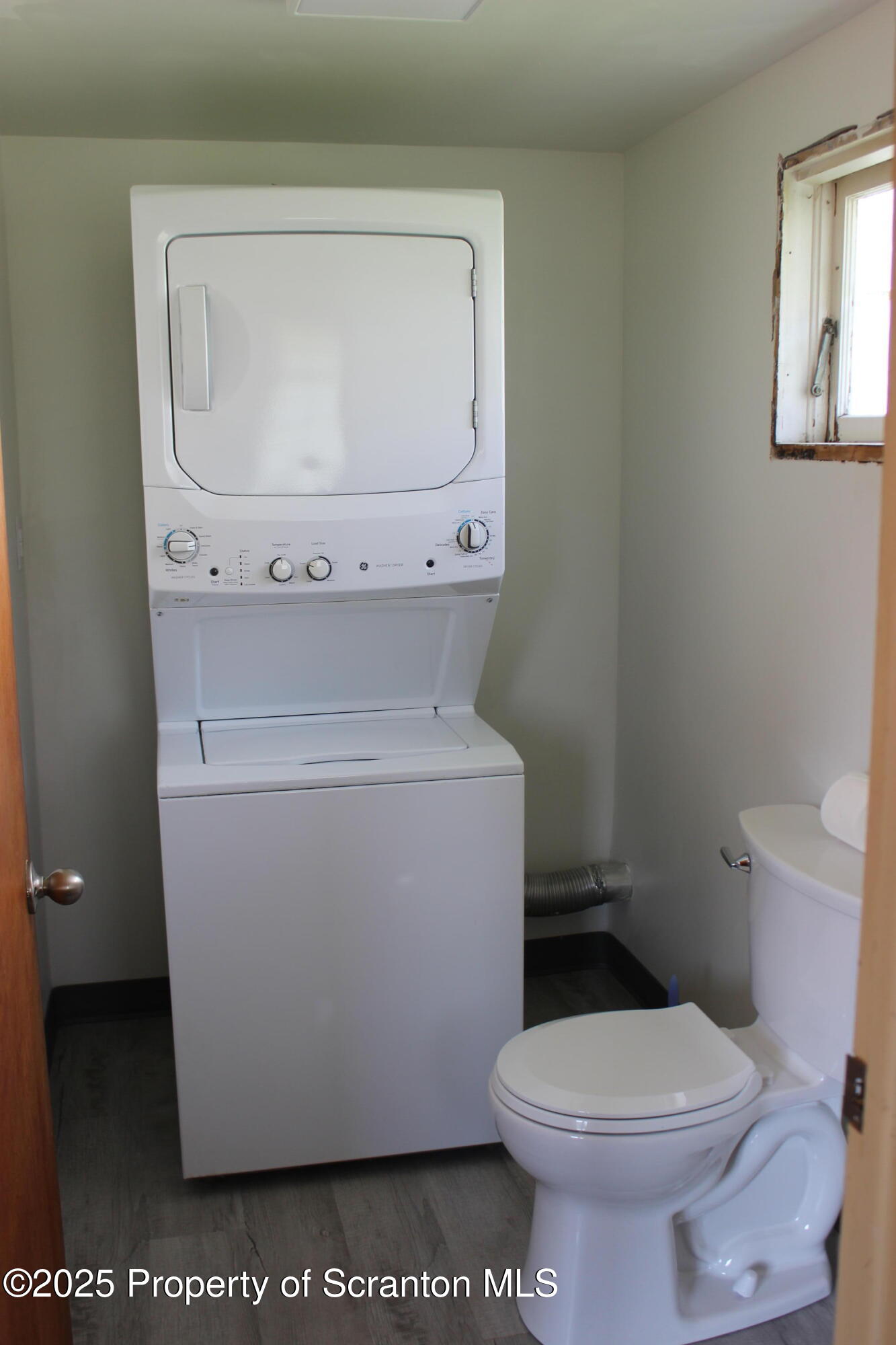 1010 McAlpine Street Avoca, PA 18641 - Photo 14 of 22 a white toilet sitting next to a bathroom sink