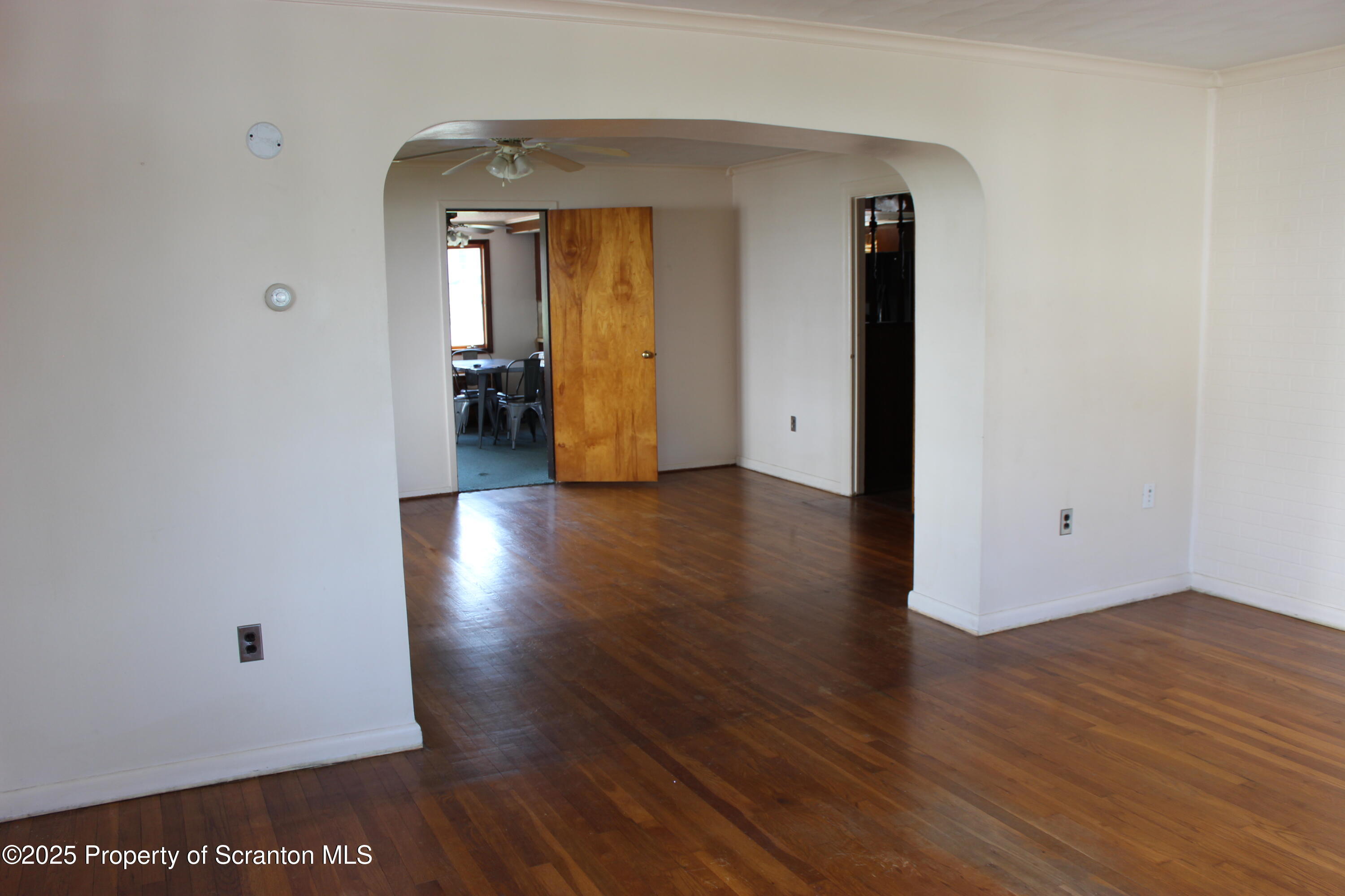 1010 McAlpine Street Avoca, PA 18641 - Photo 4 of 22 a view of a hallway with wooden floor