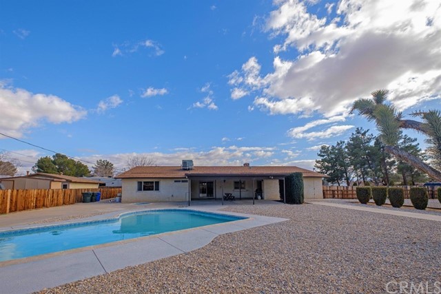 14120 Hopi Road Apple Valley, CA 92307 - Photo 1 of 1 a front view of a house with a yard and garage