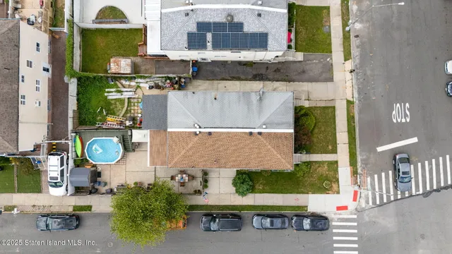 an aerial view of a house with a swimming pool