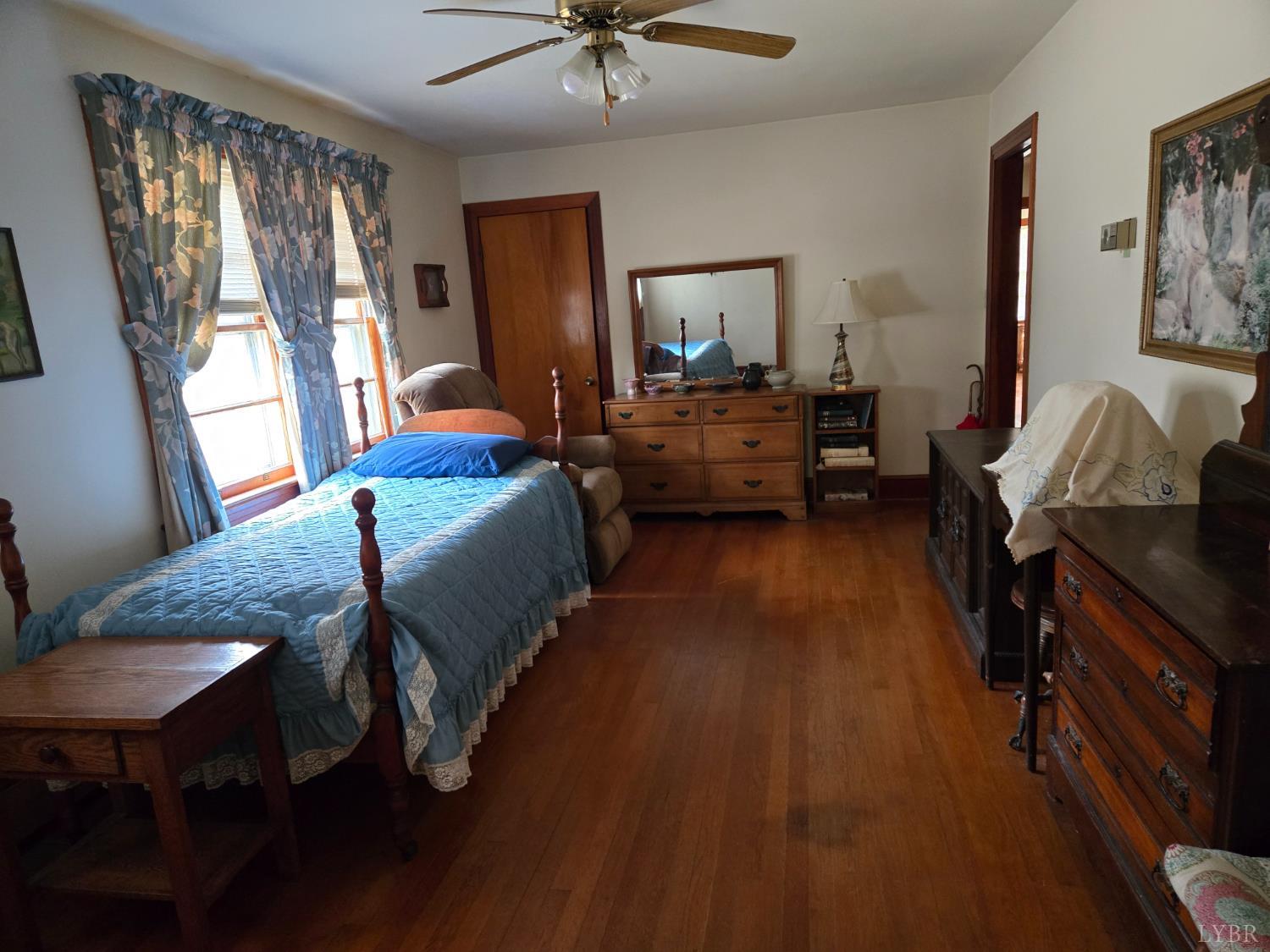 1700 Ward Street Farmville, VA 23901 - Photo 12 of 20 a bedroom with a bed and a chandelier