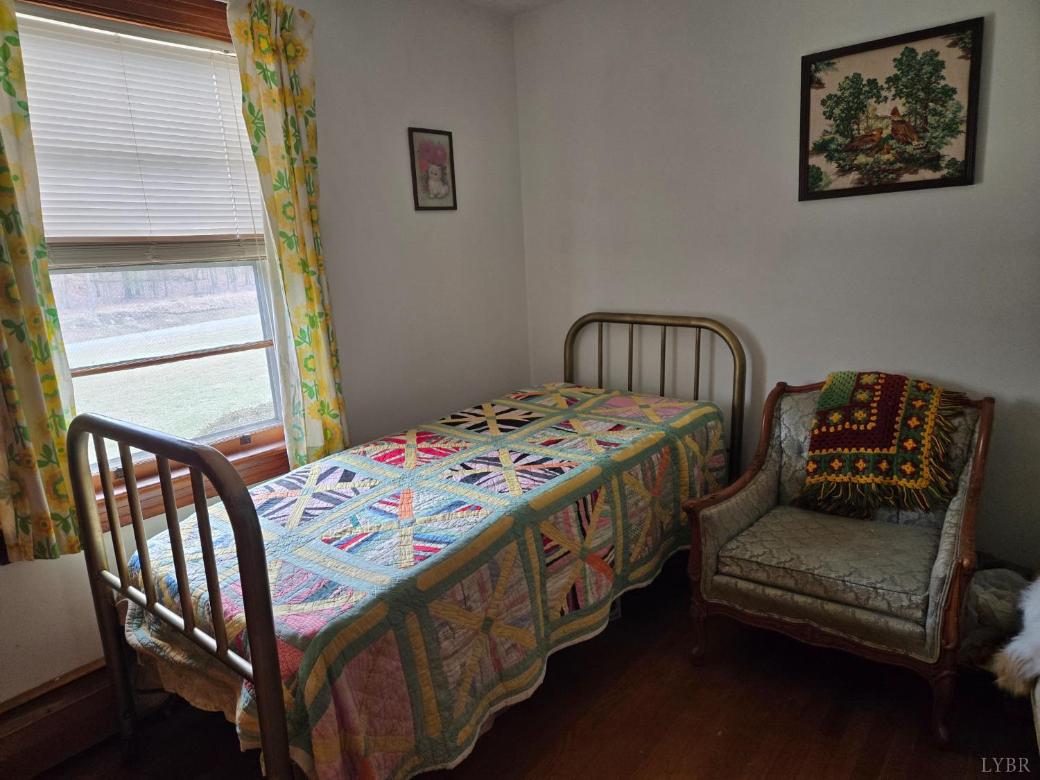 1700 Ward Street Farmville, VA 23901 - Photo 17 of 20 a bedroom with a bed a dresser and a window