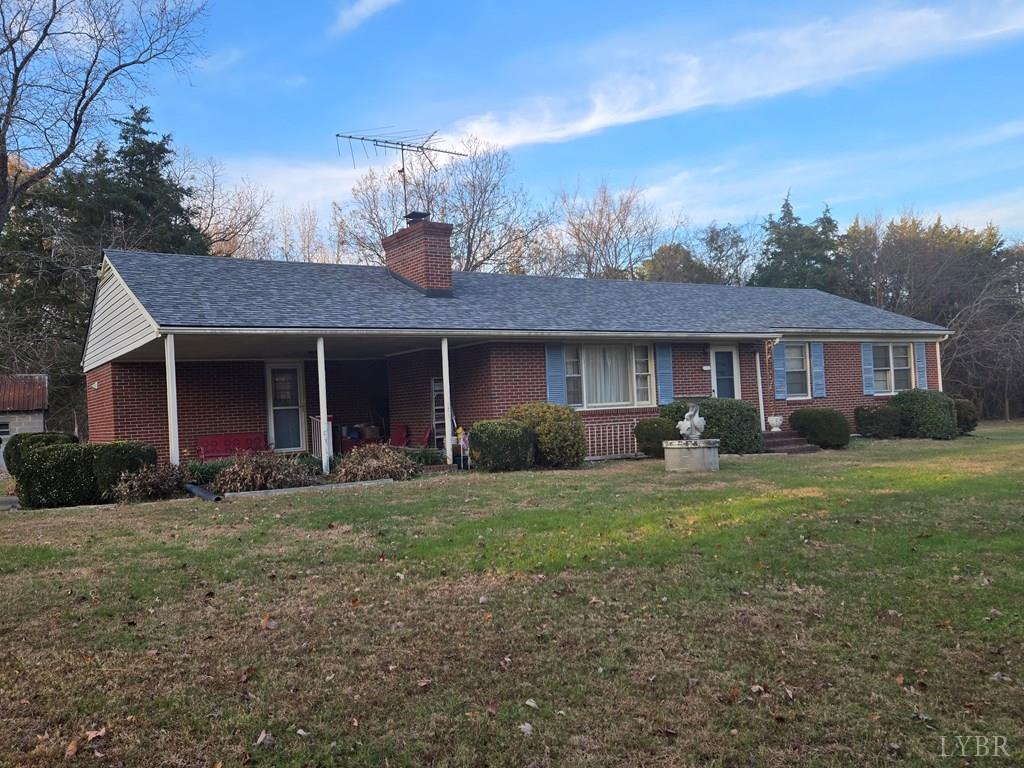 1700 Ward Street Farmville, VA 23901 - Photo 18 of 20 a front view of a house with a garden and trees