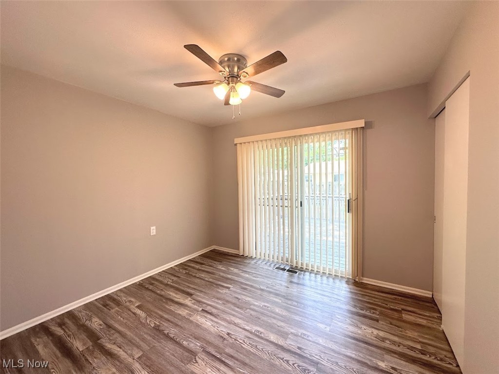 456 Nobottom Road Berea, OH 44017 - Photo 7 of 11 Unfurnished room featuring ceiling fan and wood-type flooring