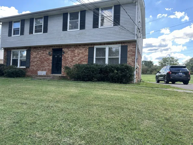a brick house with a yard