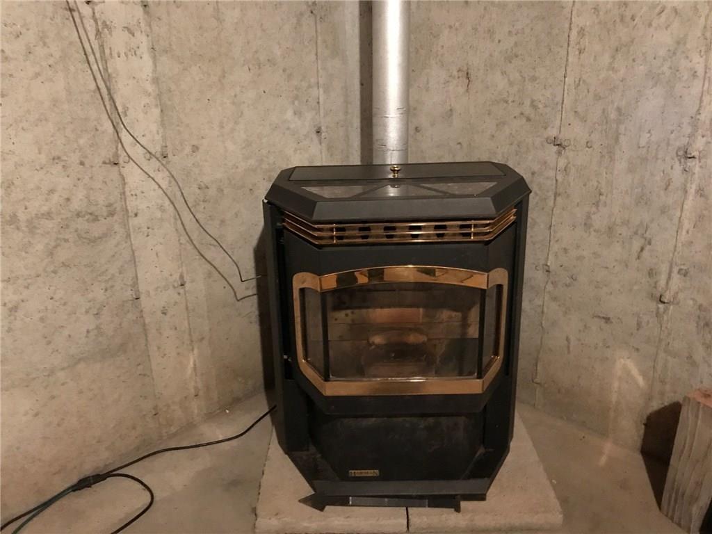 52 Pond Road Abbot, ME 04406 - Photo 29 of 29 Pellet stove in basement