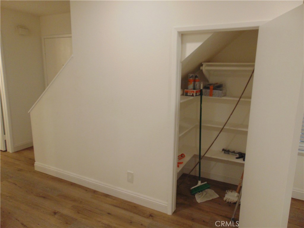 110 Tangelo Irvine, CA 92618 - Photo 7 of 13 a room with a walk in closet and wooden floor