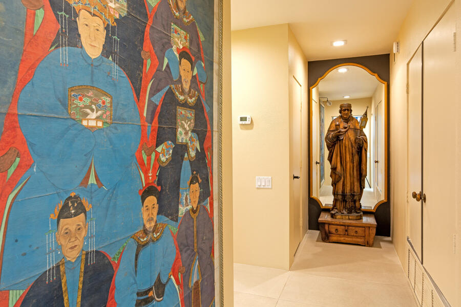 723 Inverness Drive Rancho Mirage, CA 92270 - Photo 17 of 49 a view of a hallway with wooden floor and a chandelier
